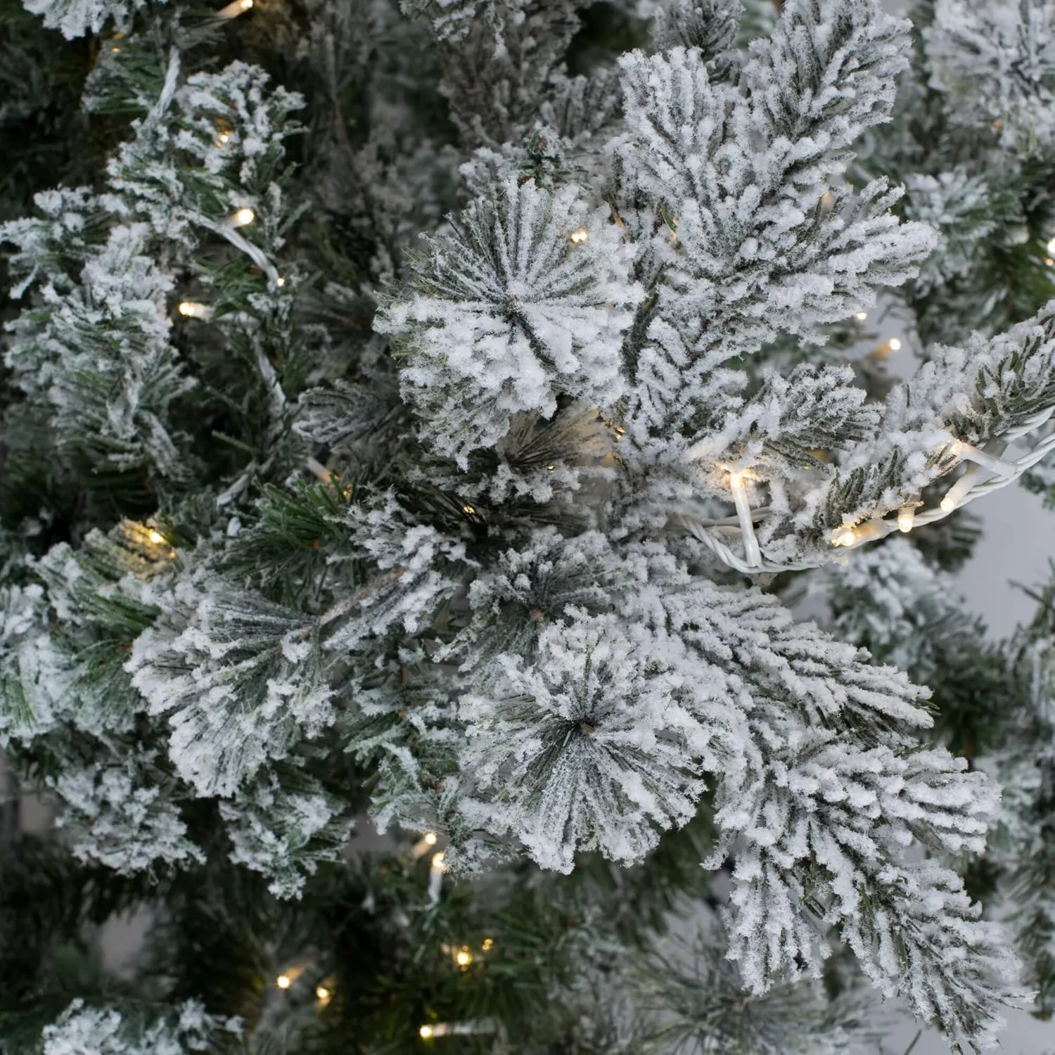 Vickerman 8.5' Flocked Sierra Fir Slim Artificial Christmas Tree, 850 Pure White LED Dura-Lit Lights - Snow Covered Faux Tree - Seasonal Indoor Home Decor